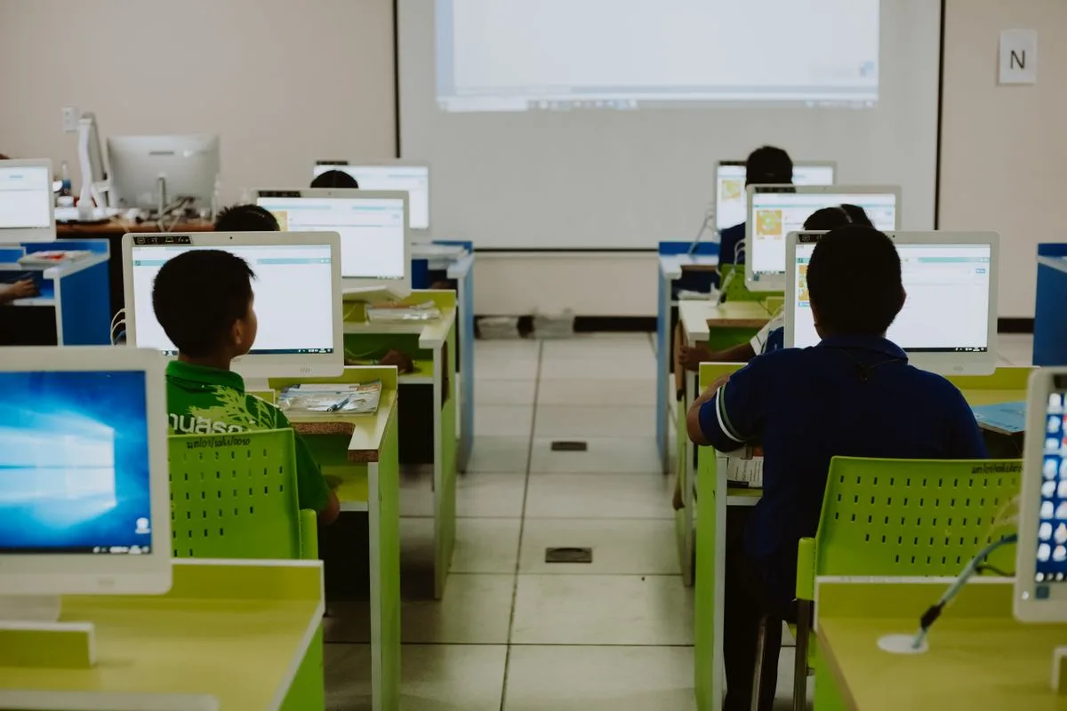 Indian students seated at computers in a classroom