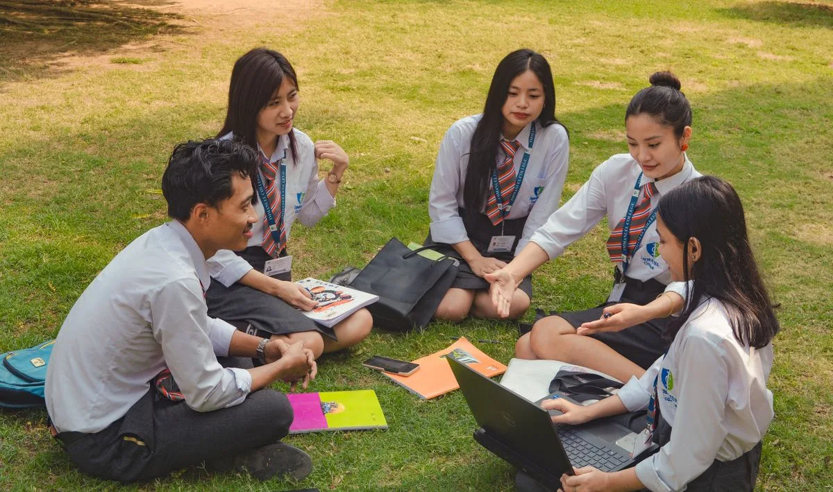 Indian college students in a group discussion outdoors